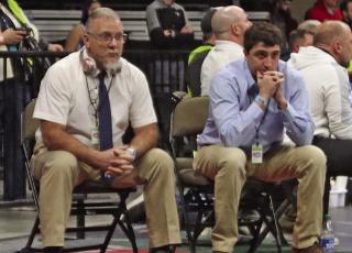 While he once considered himself fiery, the always-calm Jay Helberg, pictured here at the State Tournament with assistant coach Dillon Fries, was inducted into the NSWCA Hall of Fame Saturday in Grand Island.