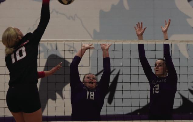 Southern Valley’s Lily Holste and Ann Bose rise to block an Alma attacker.